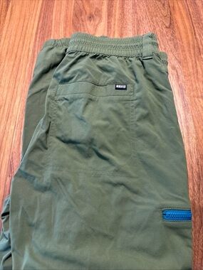REI men’s small Olive Green Hiking Pants with Blue Zip Accent
